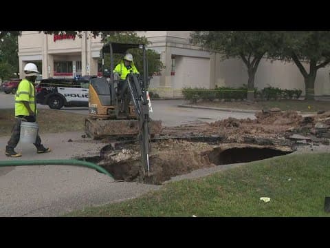 SUV gets stuck in road collapse in northwest Harris County