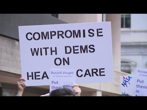 Government workers rally with lawmakers challenging federal firings during shutdown