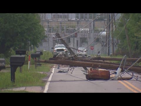 Domino effect brings down several utility poles on on street in northwest Houston