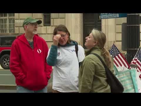 USAID workers pay mournful final visit to agency to clear out their belongings under federal guard