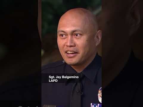 Police officer helps young marathon runner