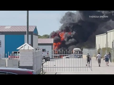 Two people were killed after a small plane crashed into an industrial parking lot
