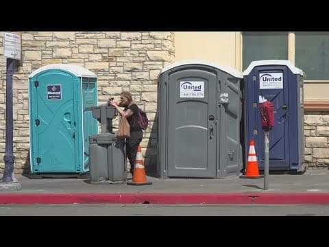 City crews conduct sweep near Petco Park in advance of Championship Series
