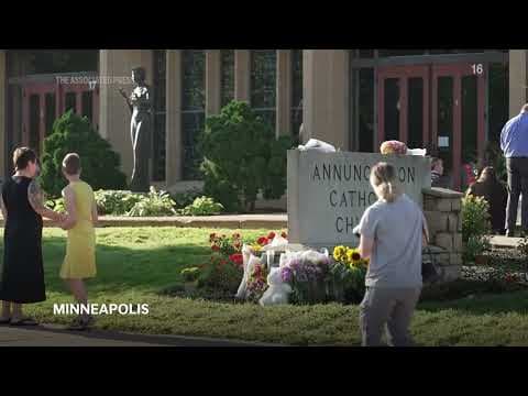 Memorial with flowers, crosses at Minnesota Catholic church