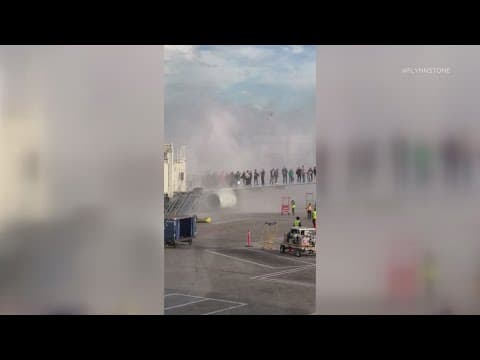 American Airlines plane catches fire at Denver airport.