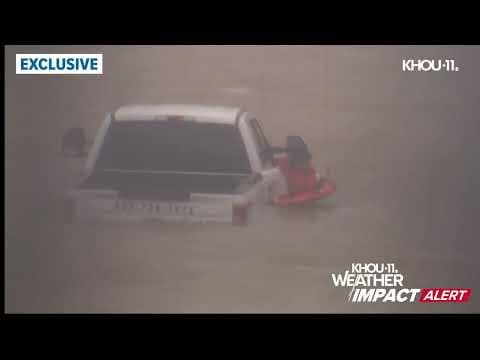 Caught on camera: Man stranded on top of truck being rescued from Hurricane Beryl floodwaters
