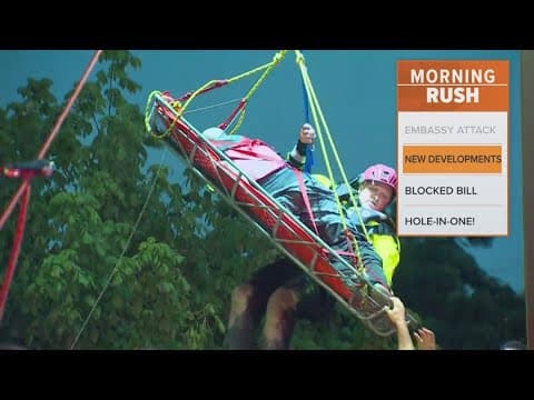 Man rescued in highwater says someone pushed him in