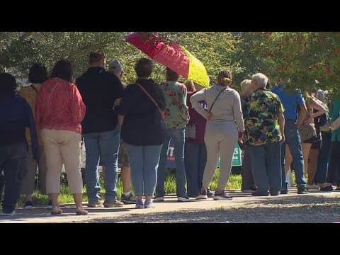 Early voters in Dallas County wait in line for more than 2 hours on Monday