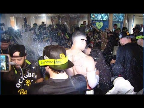 San Diego Padres celebrate in locker room after clinching MLB playoff spot