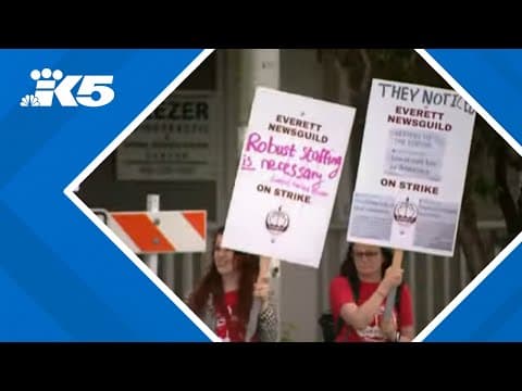 Everett Herald employees protesting layoffs that cut nearly half its newsroom staff