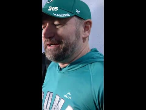 Fan reacts after catching Cal Raleigh's 61st homerun of the season