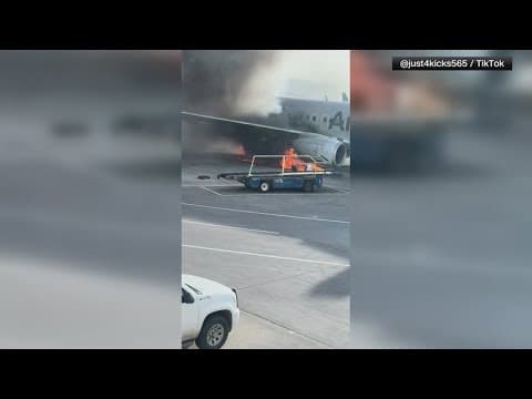 American Airlines plane catches fire at Denver airport
