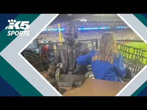 Dave Niehaus' daughter sits at his statue as Mariners secure playoff victory