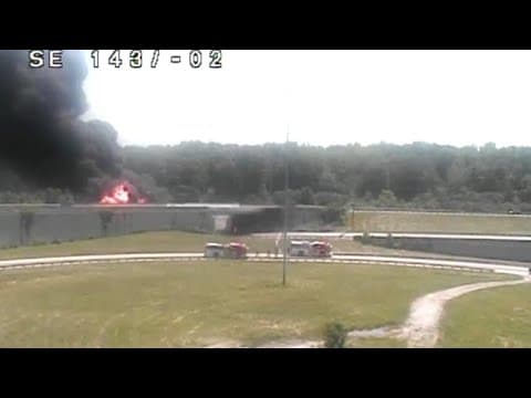 Police say black pickup truck struck tanker trailer, causing it to overturn and ignite on I-270