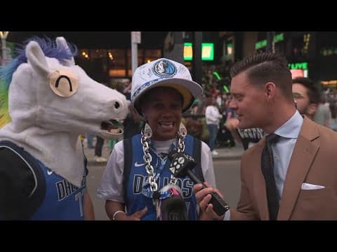WFAA's Mike Leslie speaks to fans outside the TD Garden ahead of Game 1 tipoff