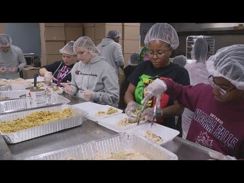 Mozel Sanders Foundation volunteers preparing thousands of Thanksgiving meals