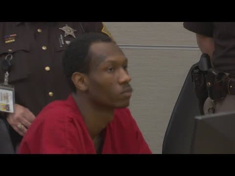 Suspect in Lawrence triple murder in court while alleged accomplice still at large