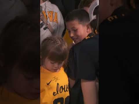Caitlin signs autographs after Big Ten win