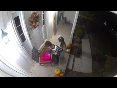 Security camera captures 8-year-old putting candy into an empty bowl during trick-or-treating