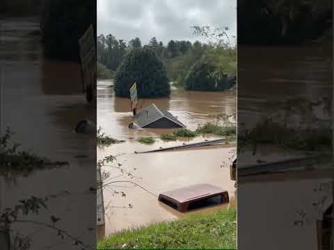 Roof Floats By During Asheville, NC, Flooding
