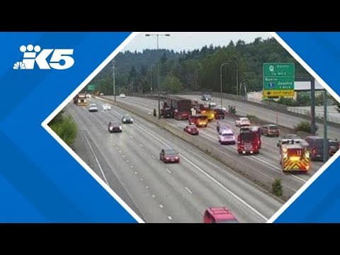 SUV ends up under semi on I-405 S