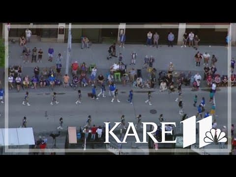 Sunshine washes out storm for Aquatennial Torchlight parade