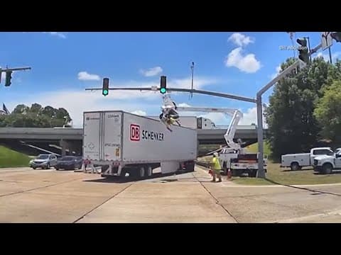 Dashcam video shows semi smashing into bucket truck, leaving utility worker upside down