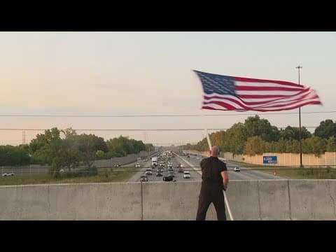 Air Force veterans waves American flag at I-465 overpass to remember 9/11 victims
