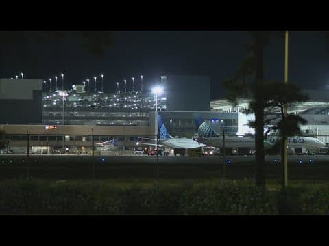 Passenger arrested after trying to open airplane door at Bush Airport, officials say