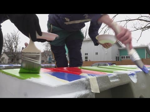 Fountain Square neighbors help decorate barriers for upcoming road safety project