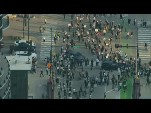 Woman charged after ramming her car into crowd of immigration protesters in Chicago