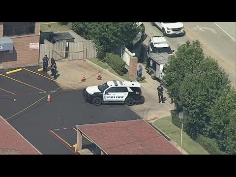 Person beheaded at Dallas motel, suspect in custody, police sources say