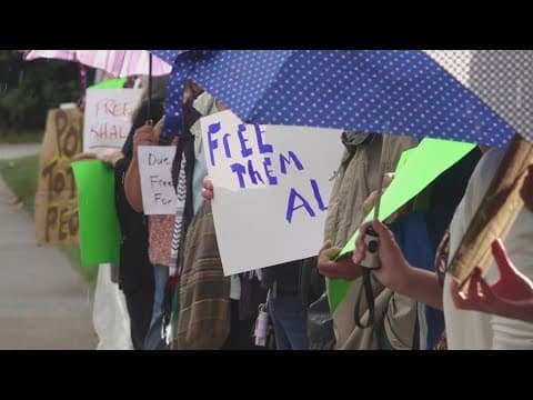 Community members line sidewalk in UT for 'Vigil to Support Students' demonstration
