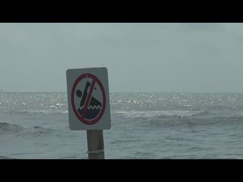 Man dies after late-night dip in restricted Gulf waters. Woman remains in ICU