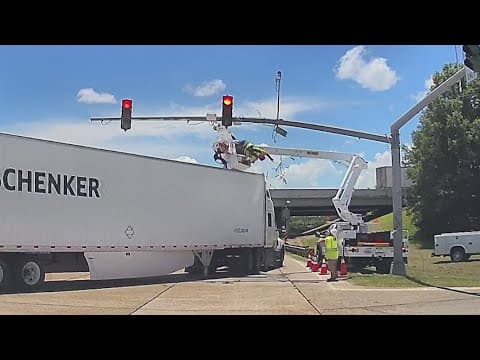 Louisiana utility worker left hanging after 18-wheeler crashes into bucket truck