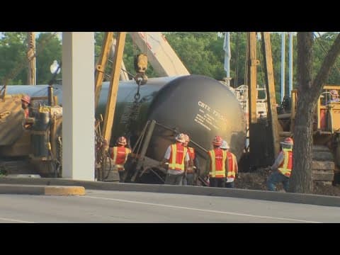 Crews work to clean up the train derailment in Downtown Waxahachie