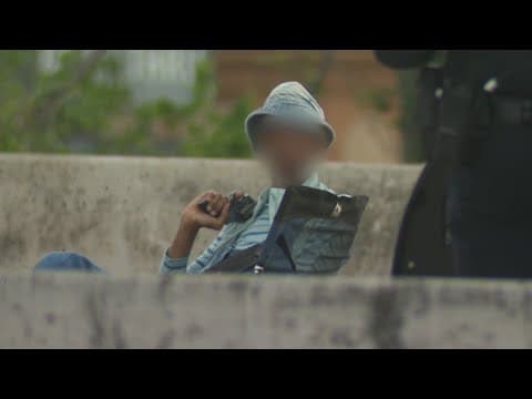 Woman hugs negotiator after surrendering, ending 5-hour-long standoff on North Freeway