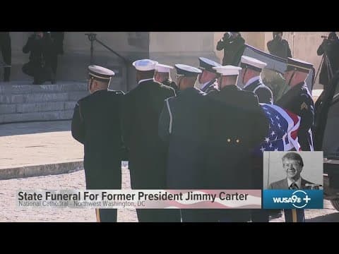 Jimmy Carter's casket is blessed after arriving to state funeral service at National Cathedral