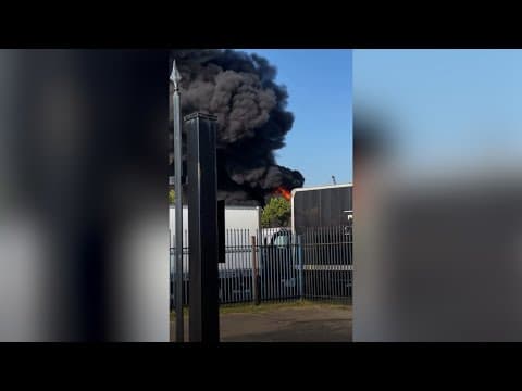 Fire sends plume of smoke into the air over Dallas near Love Field Airport