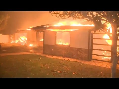 Hurricane-force winds fuel multiple fires raging in Southern California
