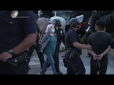 Protesters arrested as a second night of curfew went into effect in downtown LA