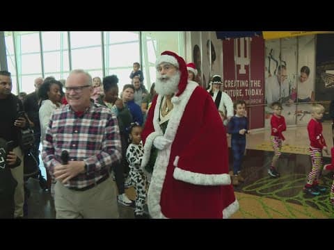 Santa Claus greets families at Indianapolis airport for 13th year in a row