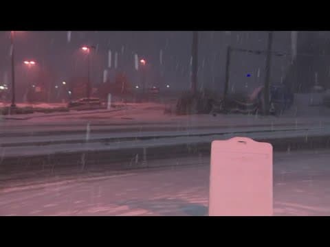 Snowy conditions in Tysons, Virginia as snow comes down Friday