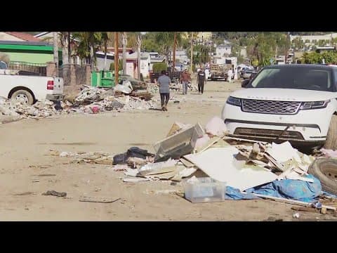 Volunteers in Southeast San Diego help with flood cleanup