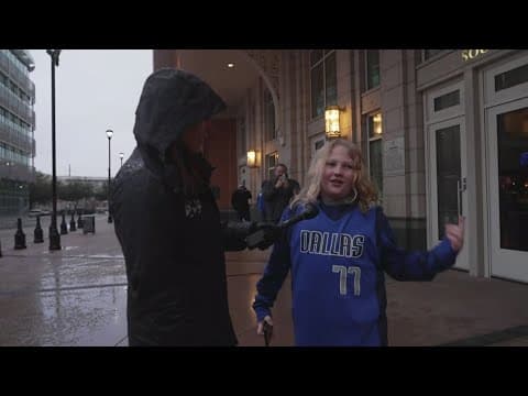 Fans gathering in the winter weather outside the American Airlines Center to see the Mavs play