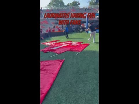Ohio State LB coach James Laurinaitis plays catch with fans