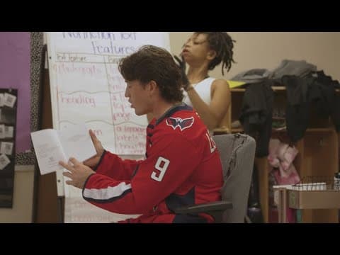 Caps forward visits school
