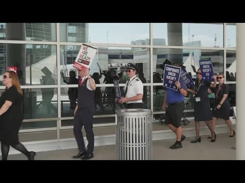 American Airlines flight attendants picketing at DFW Airport amid stalled contract negotiations