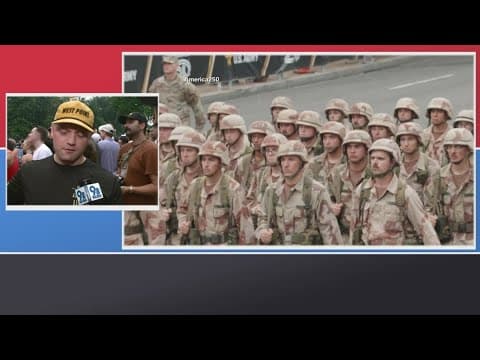 Crowd energy focuses on capturing memories of the parade