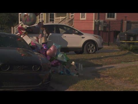 Family and community members mourn the loss of the three children killed in deadly house fire